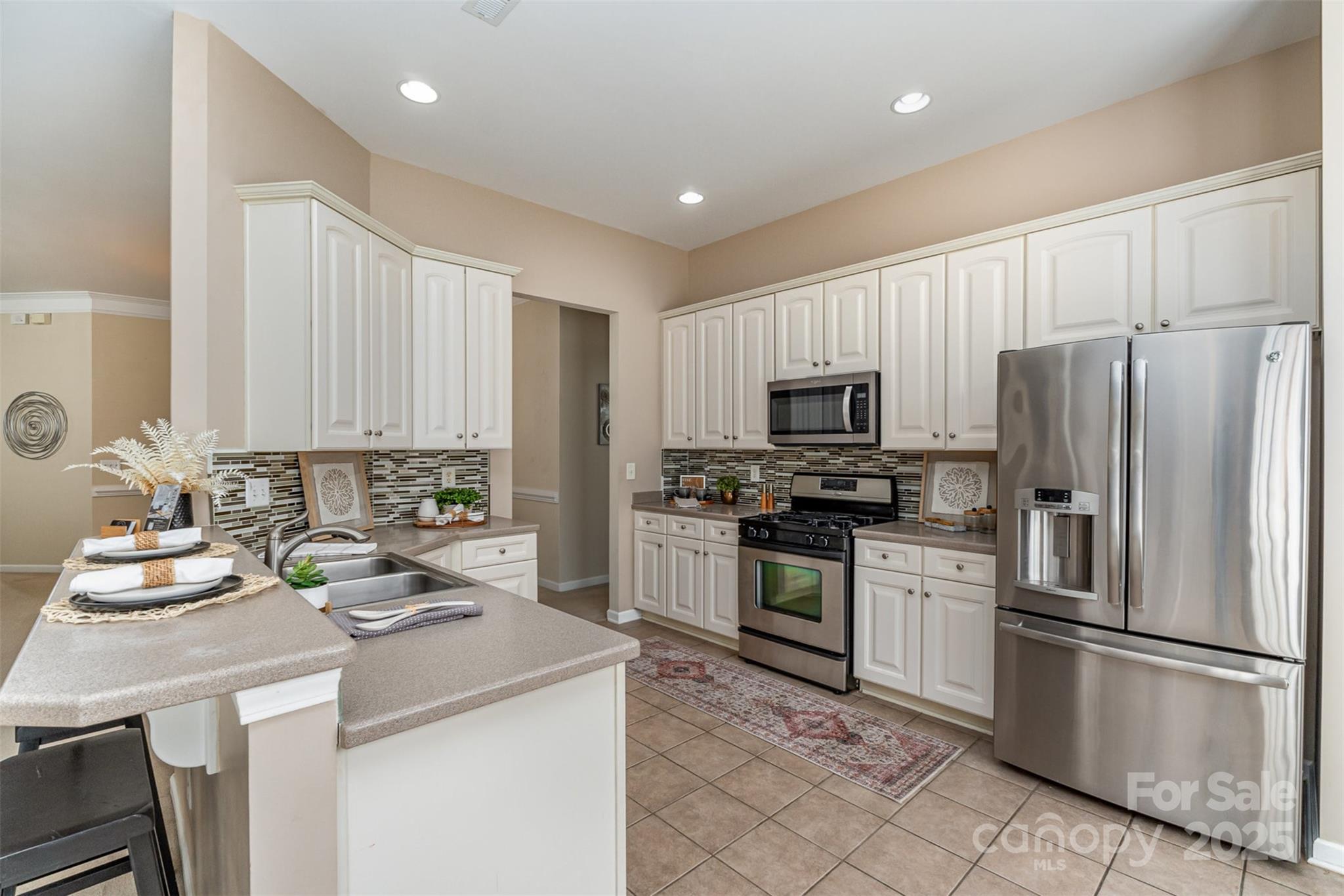 418 Garnet Court Fort Mill, SC 29708 - Photo 14 of 29 a kitchen with a sink appliances and cabinets