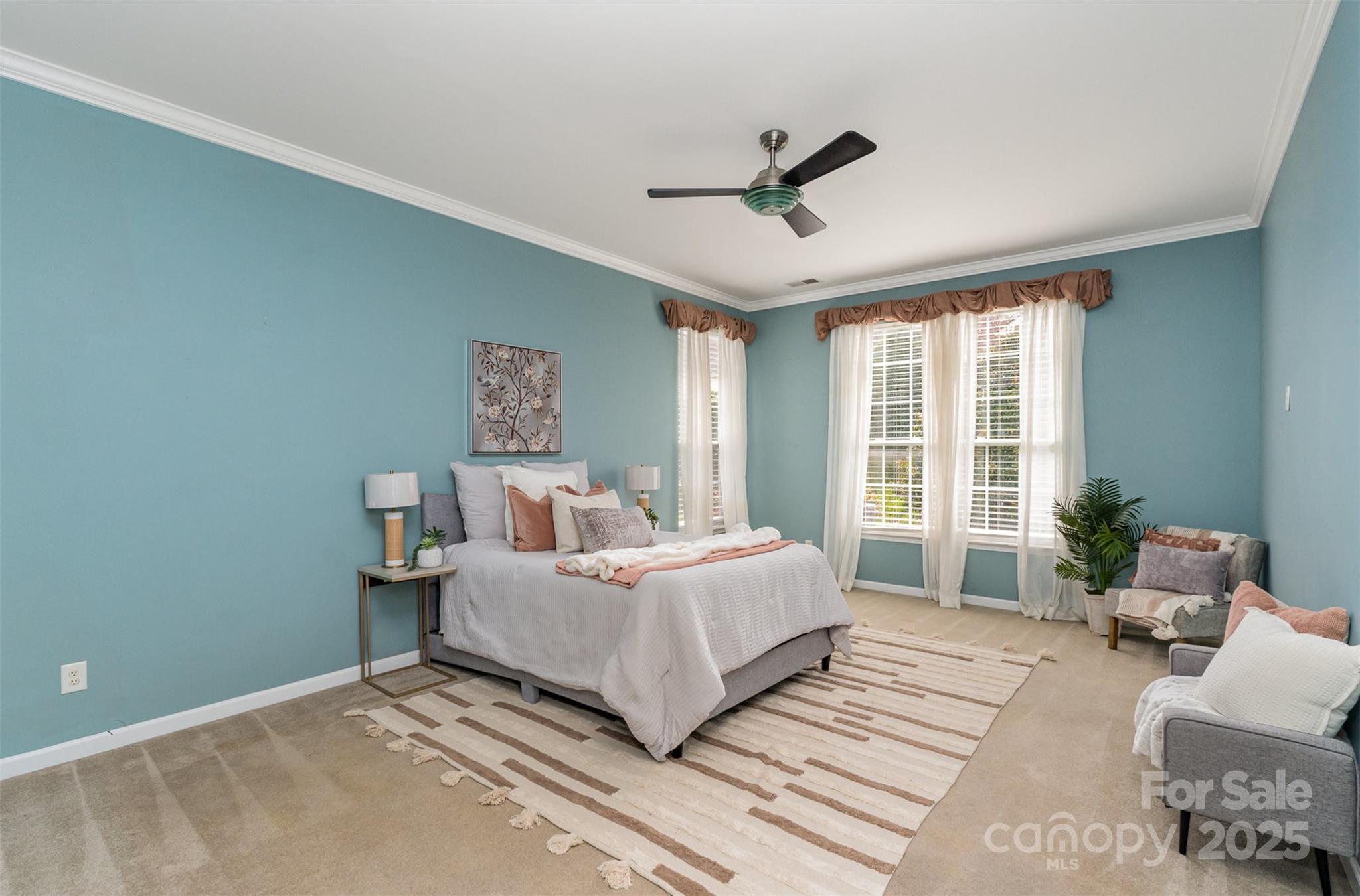 418 Garnet Court Fort Mill, SC 29708 - Photo 15 of 29 a spacious bedroom with a bed and a large window