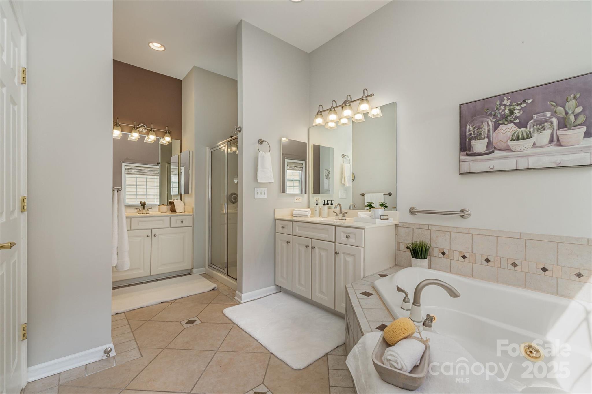 418 Garnet Court Fort Mill, SC 29708 - Photo 18 of 29 a bathroom with a sink vanity granite tub and shower