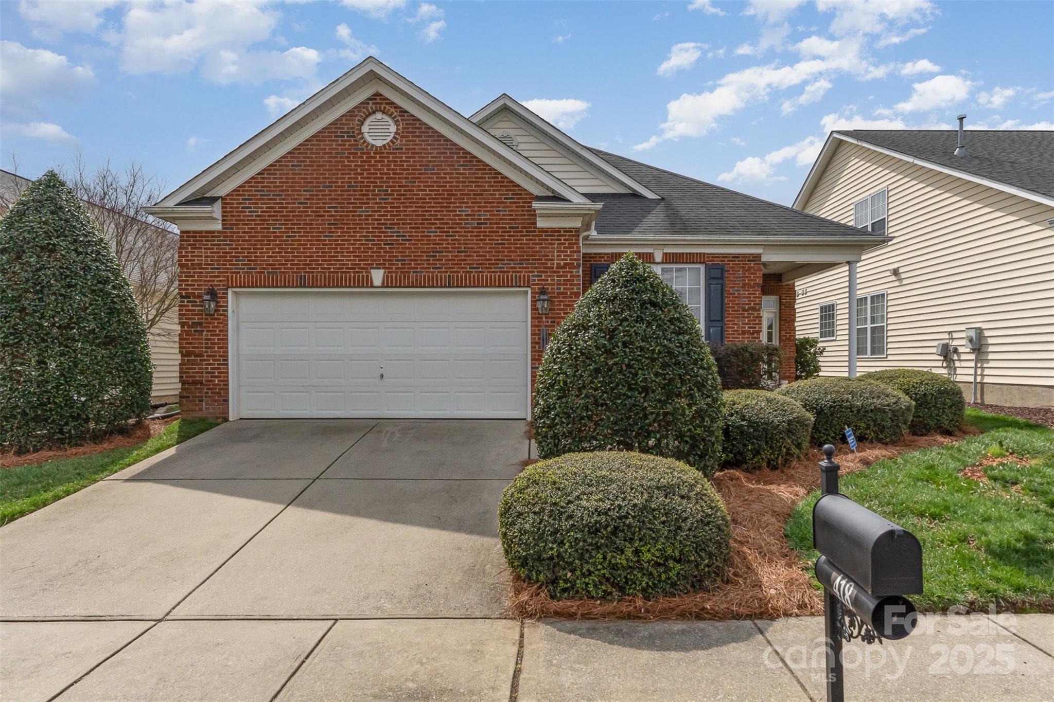 418 Garnet Court Fort Mill, SC 29708 - Photo 2 of 29 a front view of a house with garden