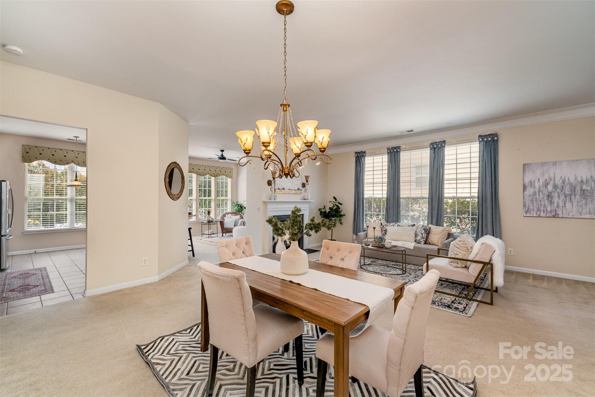 418 Garnet Court Fort Mill, SC 29708 - Photo 5 of 29 a view of a dining room with furniture a chandelier and wooden floor