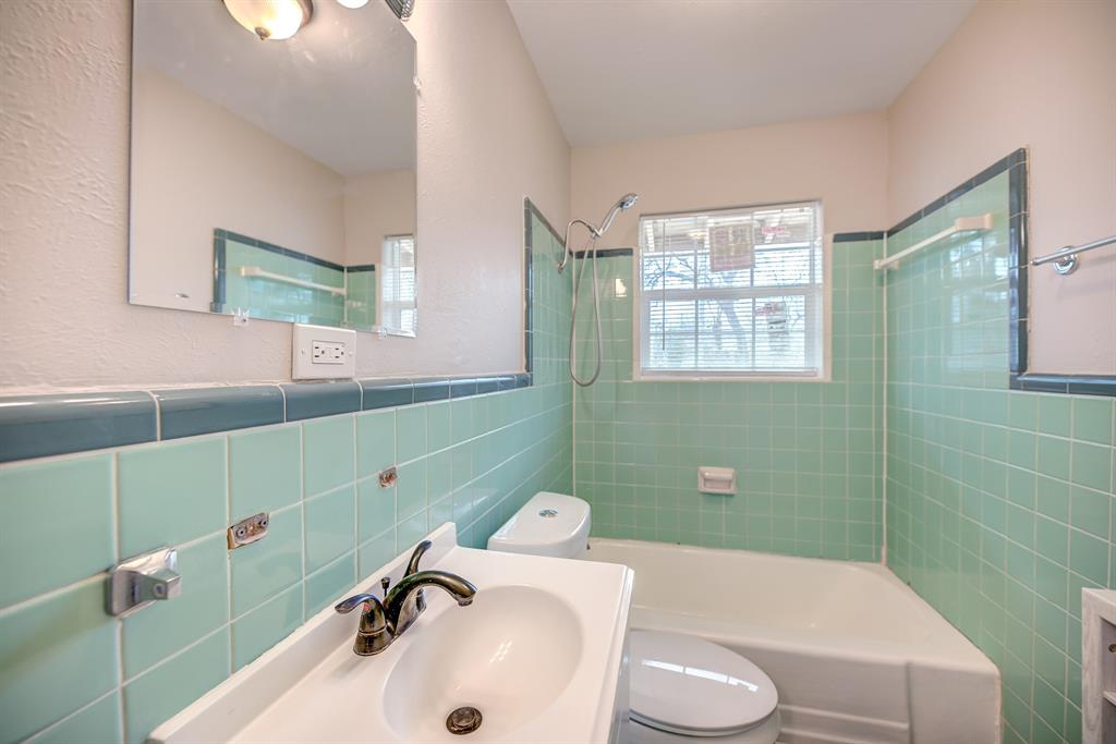 3635 Rogene Street North Richland Hills, TX 76180 - Photo 16 of 25 a bathroom with a sink and a mirror