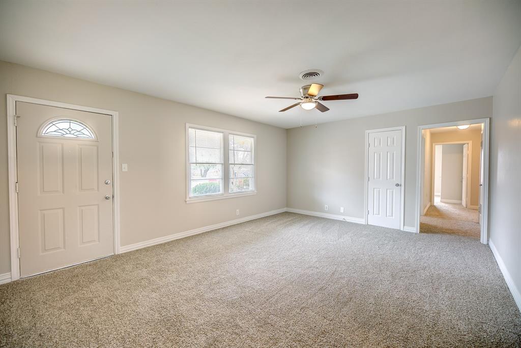 3635 Rogene Street North Richland Hills, TX 76180 - Photo 3 of 25 a view of an empty room with a ceiling fan and window