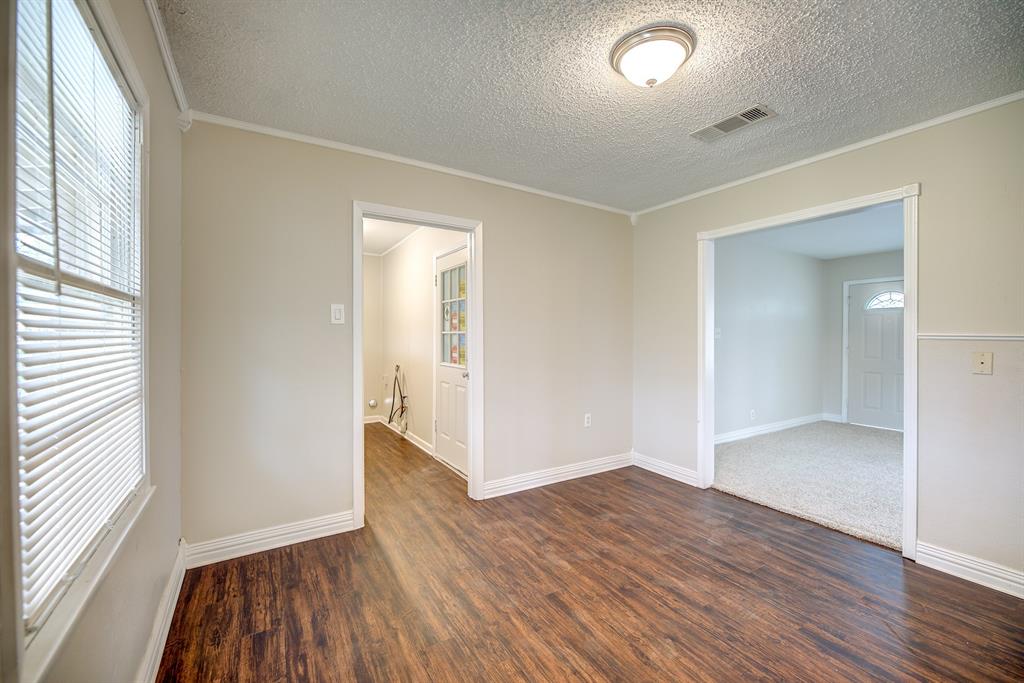 3635 Rogene Street North Richland Hills, TX 76180 - Photo 6 of 25 an empty room with wooden floor and windows