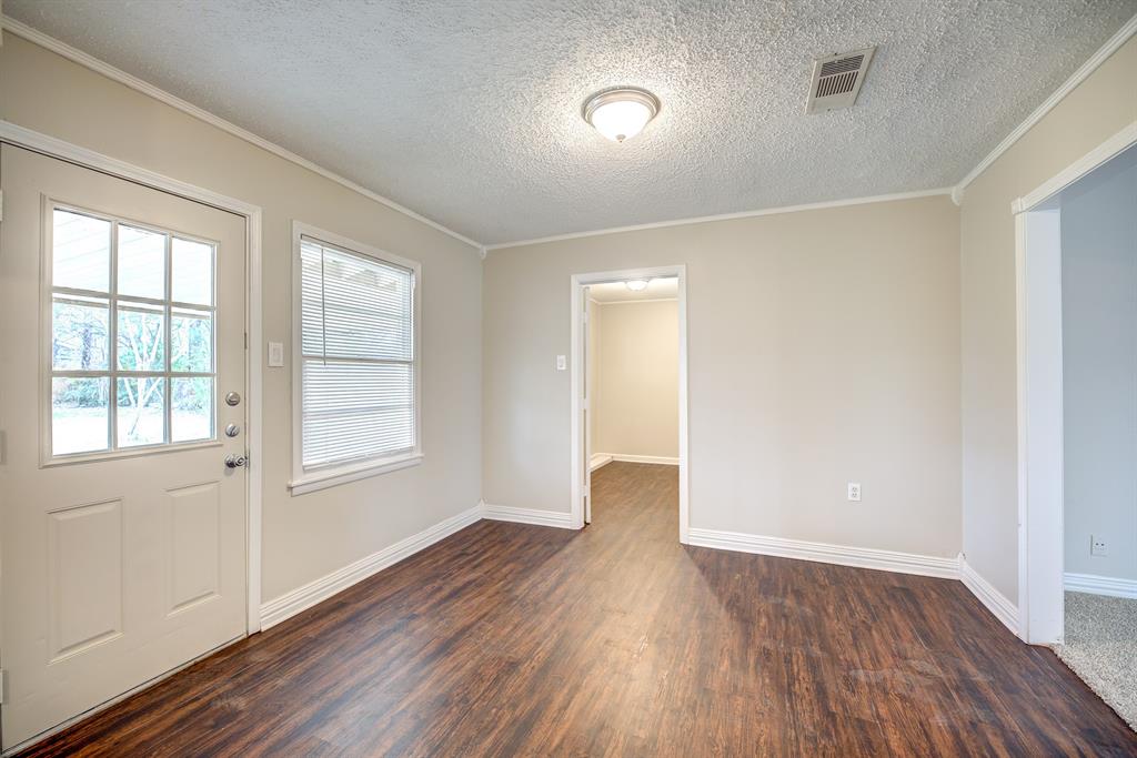 3635 Rogene Street North Richland Hills, TX 76180 - Photo 7 of 25 an empty room with wooden floor and windows