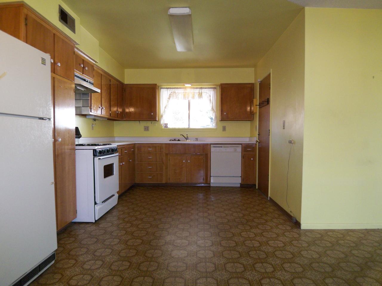 3773 Alma Avenue Redding, CA 96002 - Photo 5 of 12 a kitchen with a sink cabinets and stainless steel appliances