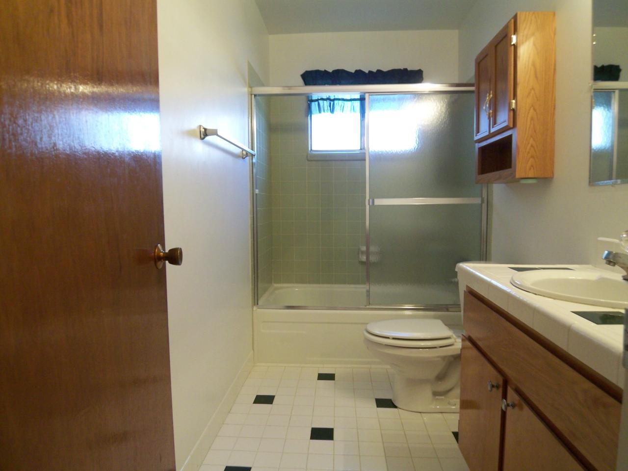3773 Alma Avenue Redding, CA 96002 - Photo 6 of 12 a bathroom with a sink a toilet and shower