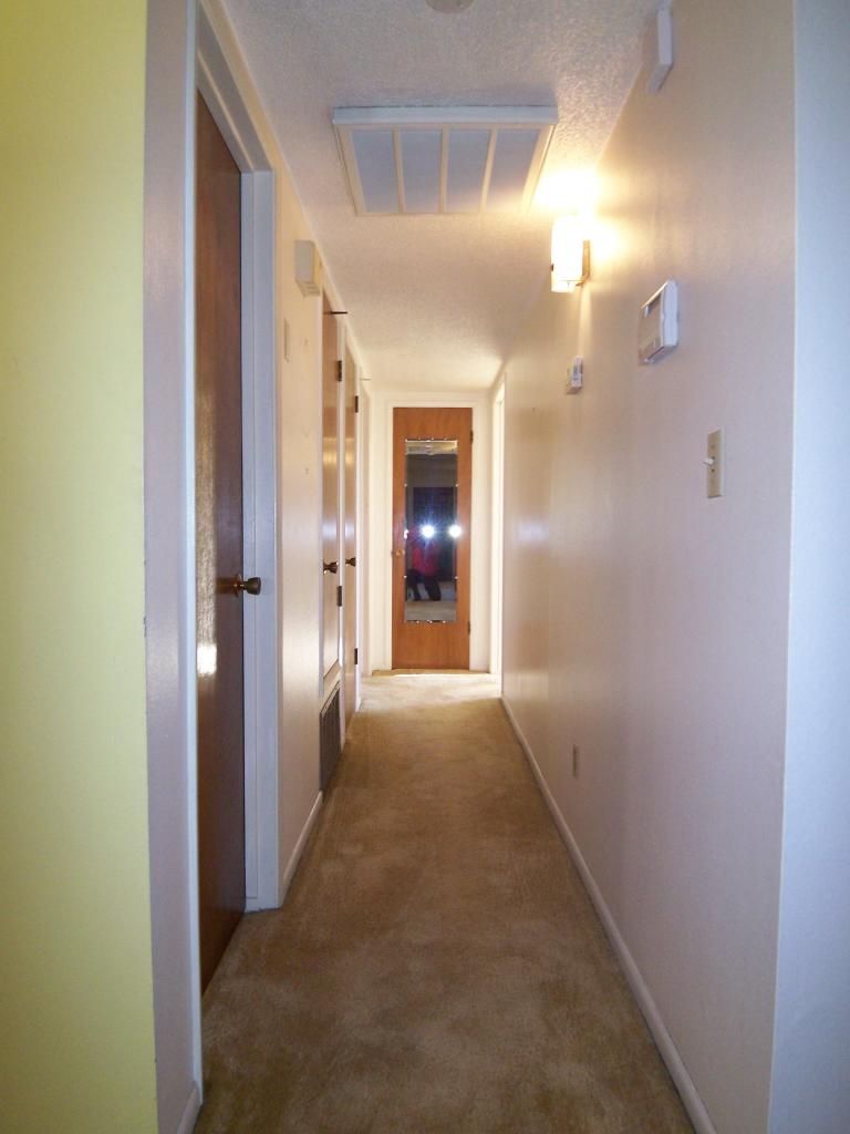 3773 Alma Avenue Redding, CA 96002 - Photo 7 of 12 a view of a hallway with wooden shelves