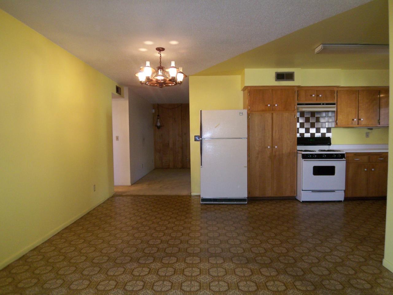 3773 Alma Avenue Redding, CA 96002 - Photo 10 of 12 a view of a kitchen with a refrigerator a microwave and a sink
