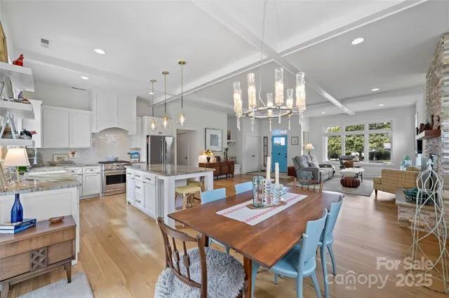 a open kitchen with granite countertop lots of counter top space and stainless steel appliances