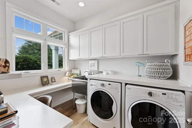 a view of kitchen sink and washer dryer