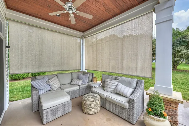 a balcony with furniture and a garden