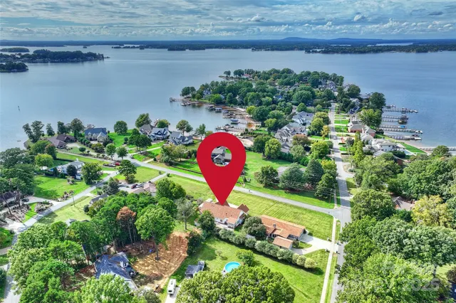an aerial view of a house with a yard and garden