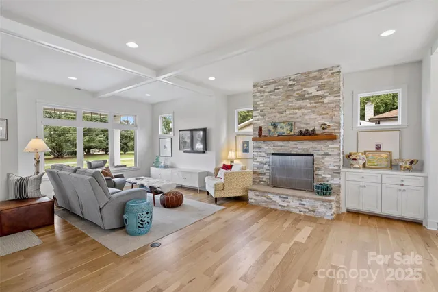 a living room with furniture and fireplace