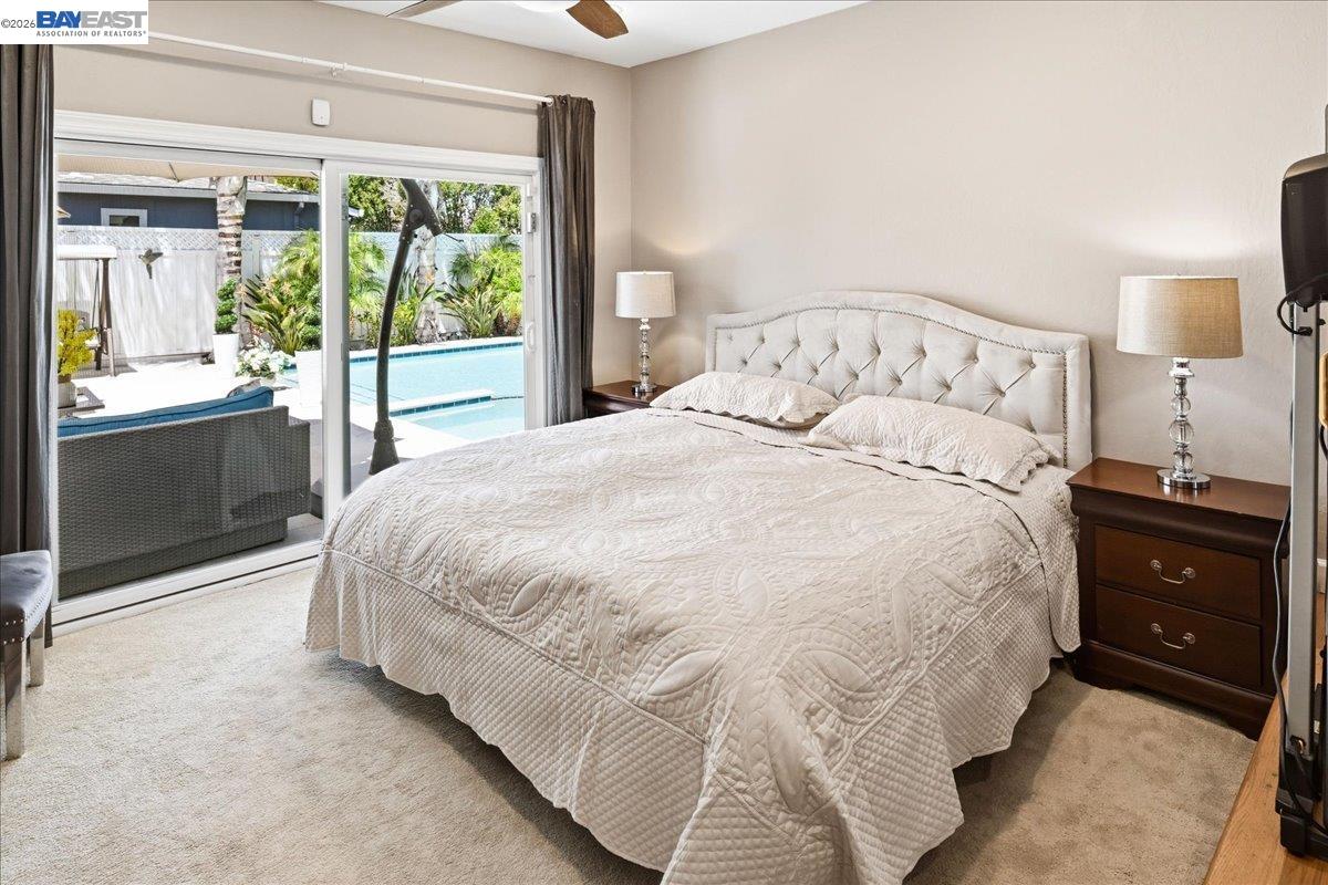 2861 Millbridge Place San Ramon, CA 94583 - Photo 29 of 58 a large bed sitting in a bedroom next to a window