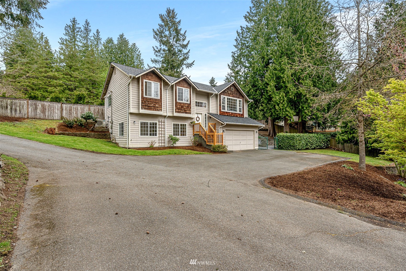 19329 Winesap Road Bothell, WA 98012 - Photo 1 of 32 a front view of a house with a yard and garage