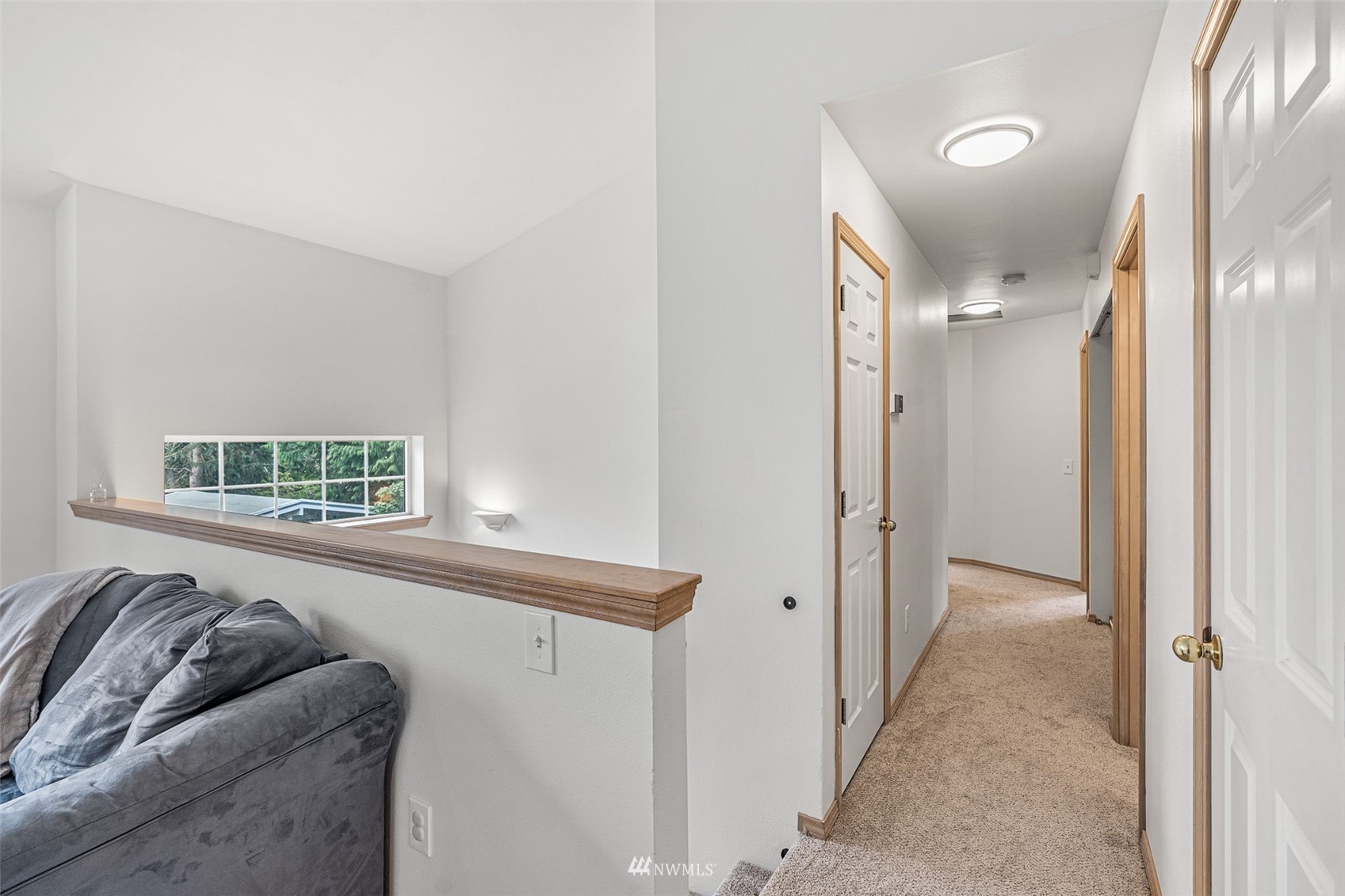 19329 Winesap Road Bothell, WA 98012 - Photo 11 of 32 a living room with a couch and a window