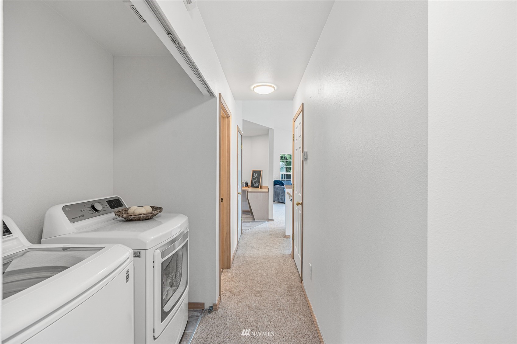 19329 Winesap Road Bothell, WA 98012 - Photo 13 of 32 a view of a storage & utility room with washer and dryer