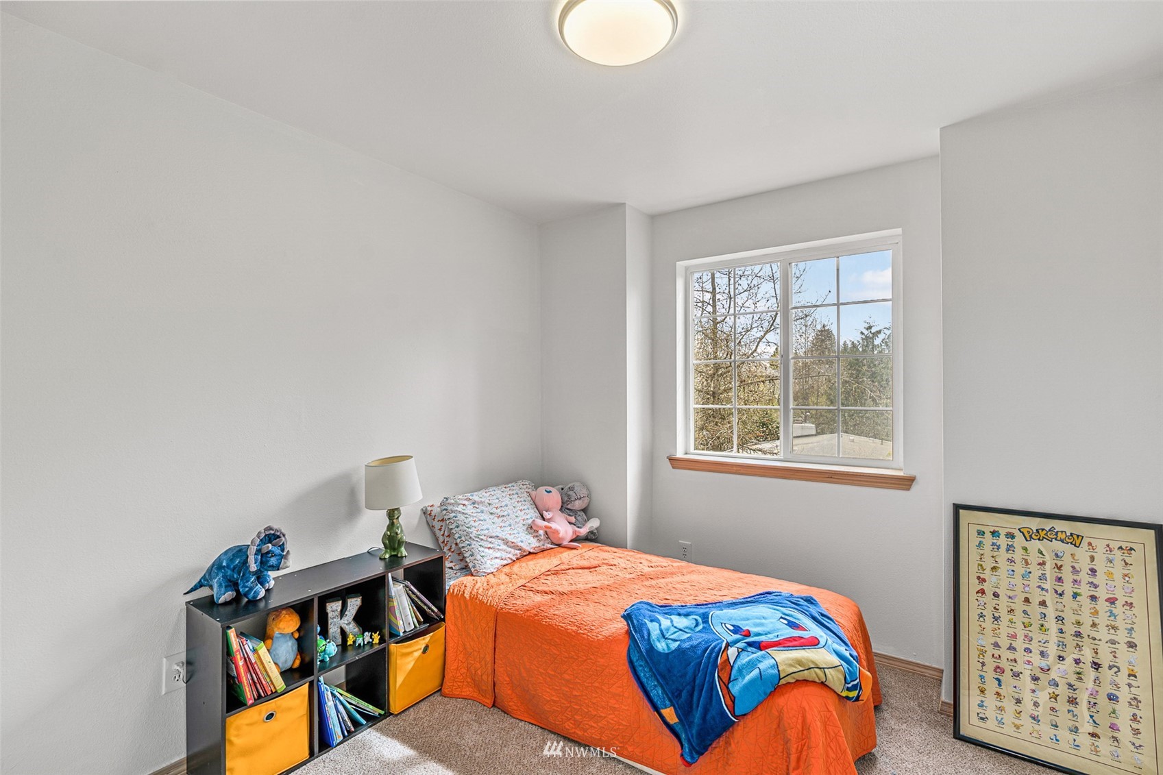 19329 Winesap Road Bothell, WA 98012 - Photo 14 of 32 a bedroom with a bed and window