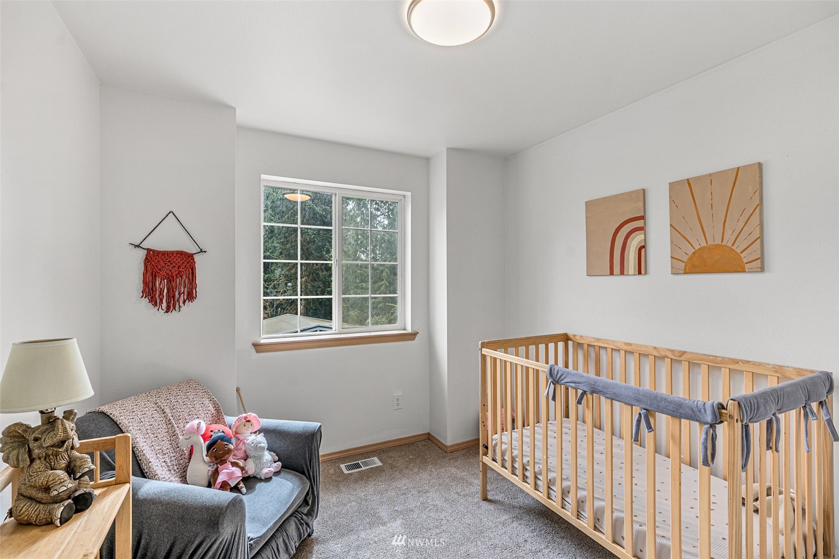 19329 Winesap Road Bothell, WA 98012 - Photo 15 of 32 a bedroom with furniture and a window