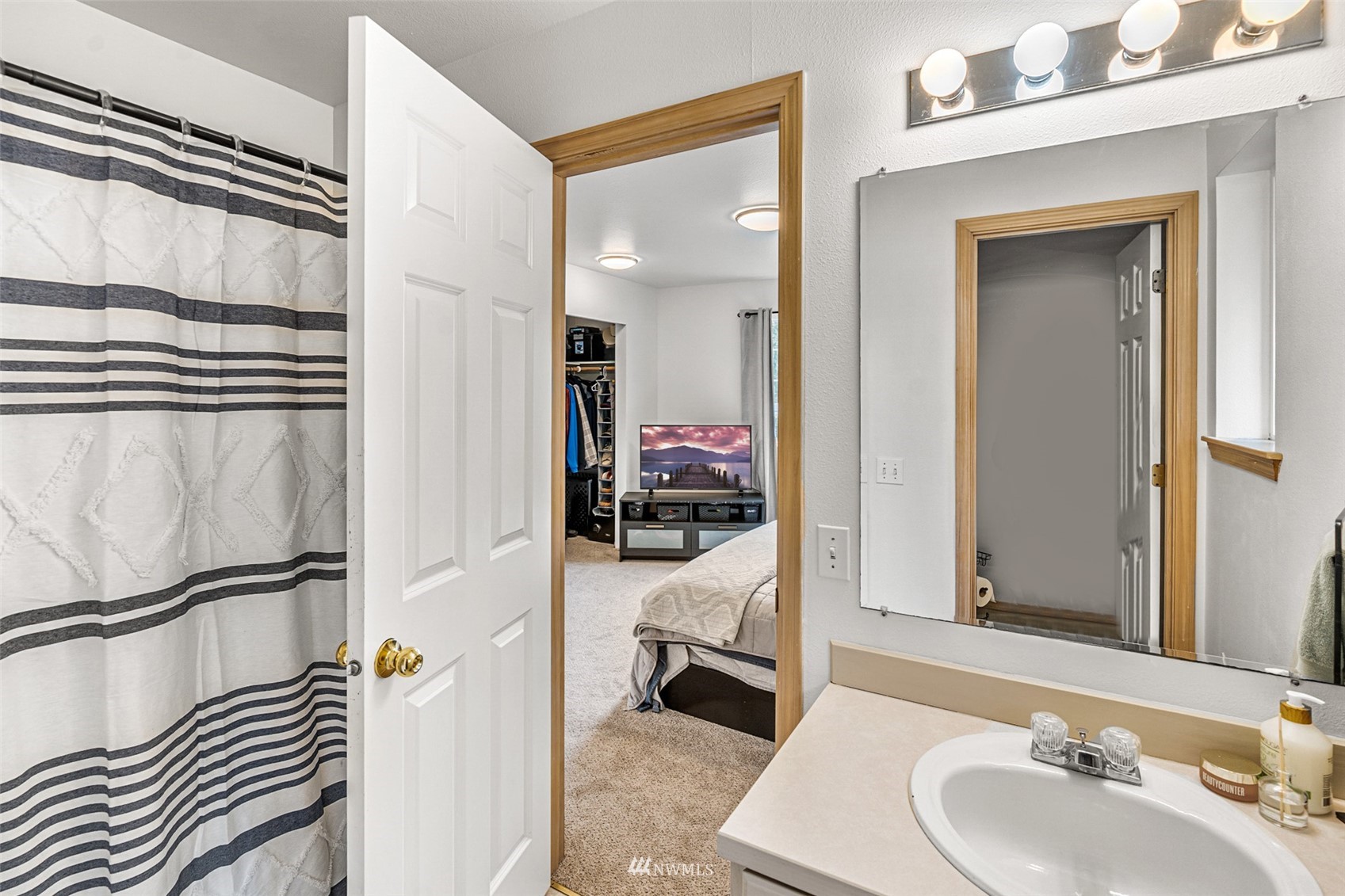 19329 Winesap Road Bothell, WA 98012 - Photo 19 of 32 a en suite bathroom with a sink and a mirror