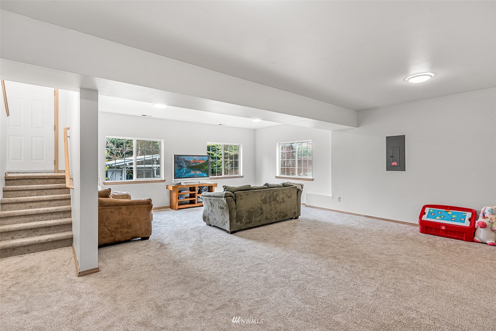 19329 Winesap Road Bothell, WA 98012 - Photo 20 of 32 a living room with furniture and a large window