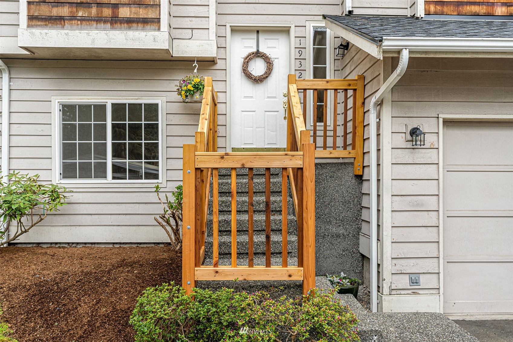 19329 Winesap Road Bothell, WA 98012 - Photo 2 of 32 a front view of a house with a garden