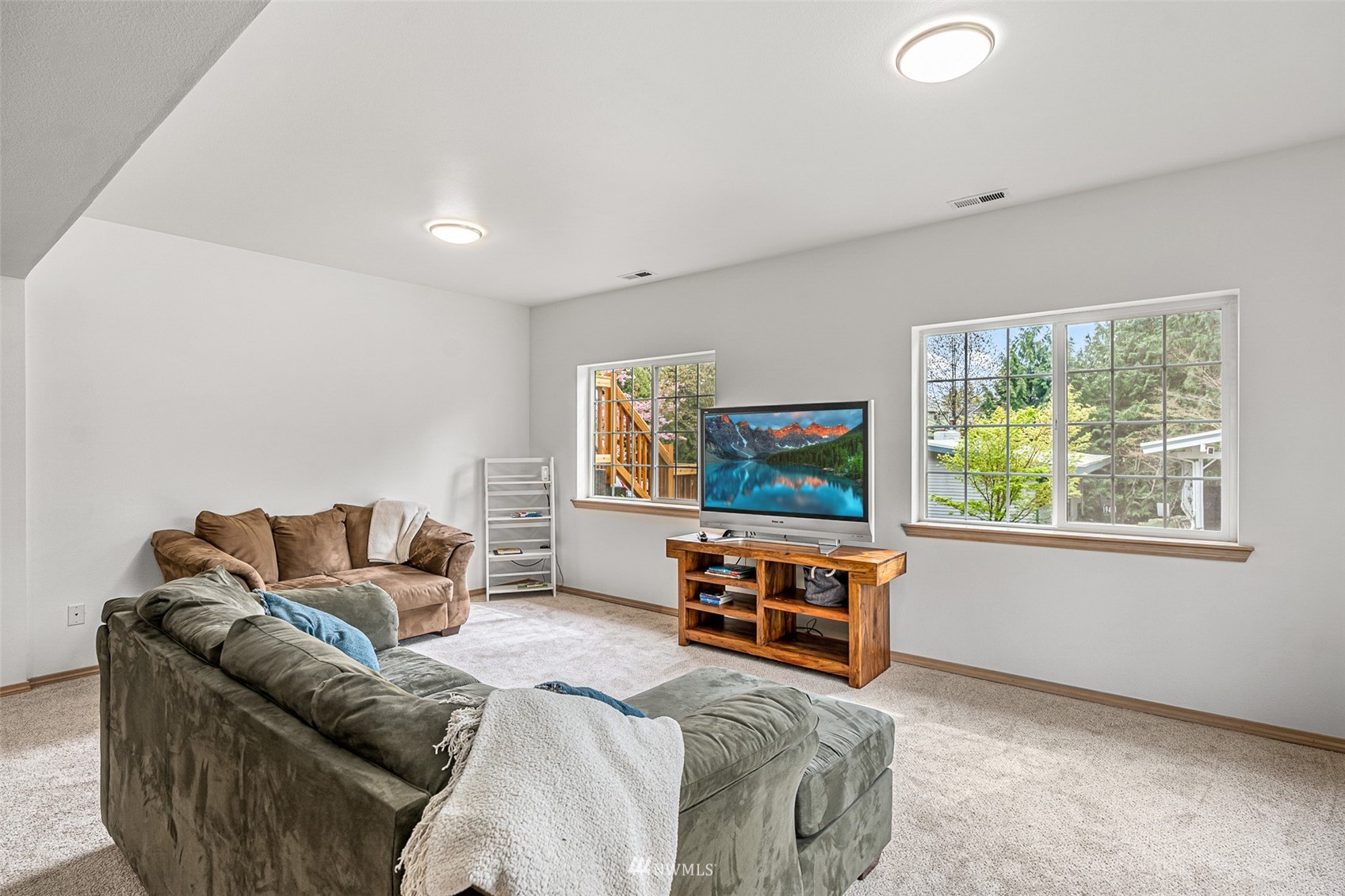 19329 Winesap Road Bothell, WA 98012 - Photo 22 of 32 a living room with furniture and a flat screen tv