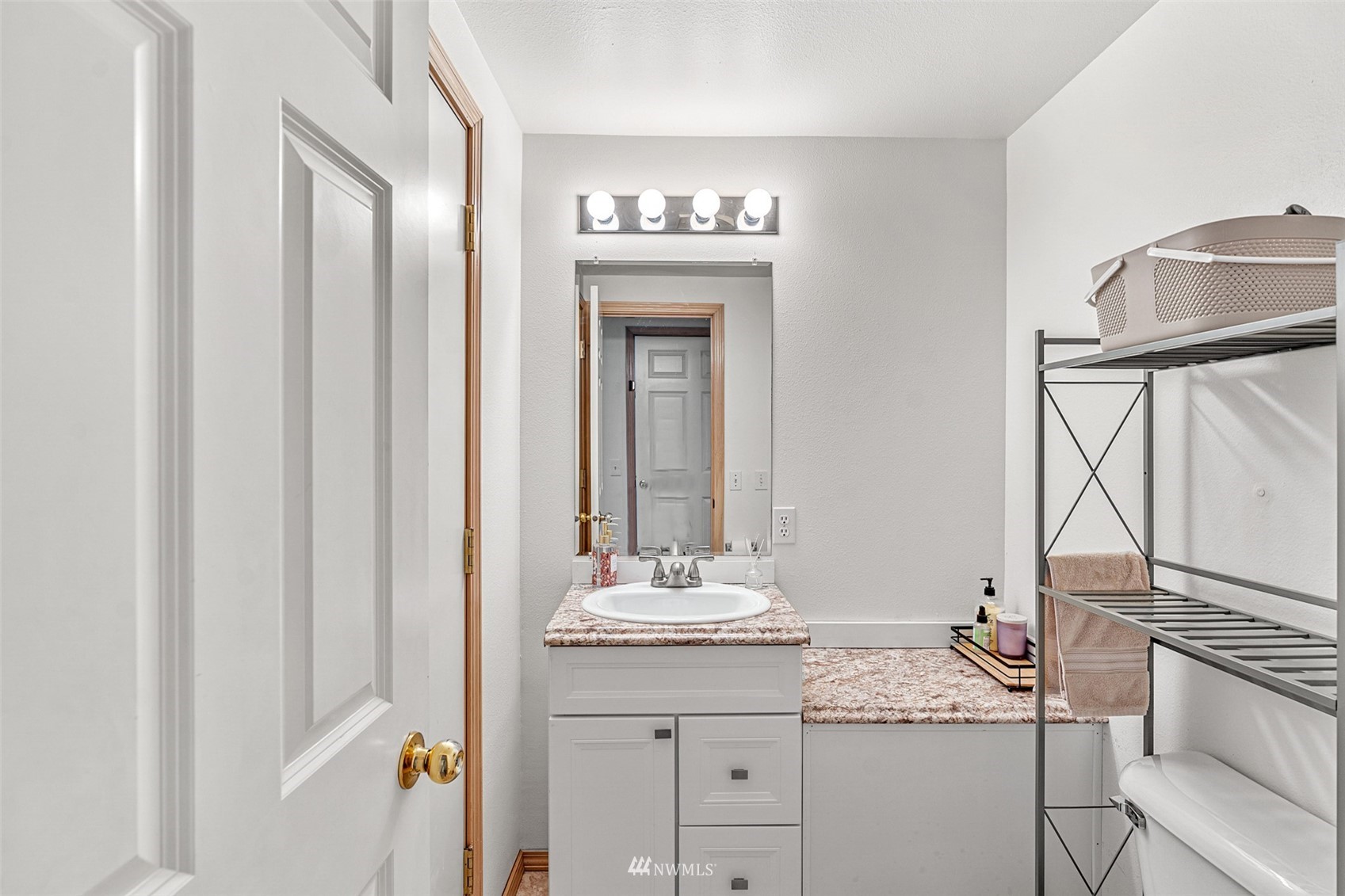 19329 Winesap Road Bothell, WA 98012 - Photo 24 of 32 a bathroom with a granite countertop sink and a mirror