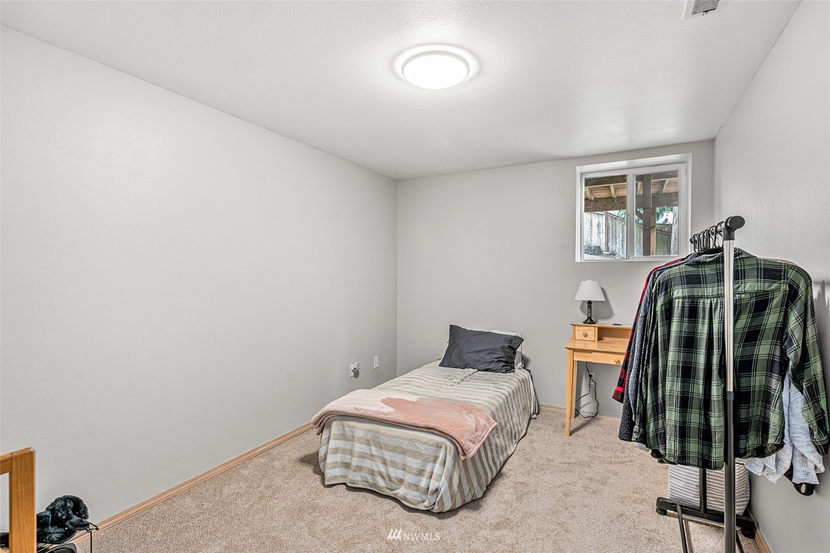19329 Winesap Road Bothell, WA 98012 - Photo 25 of 32 a bedroom with a bed and a window