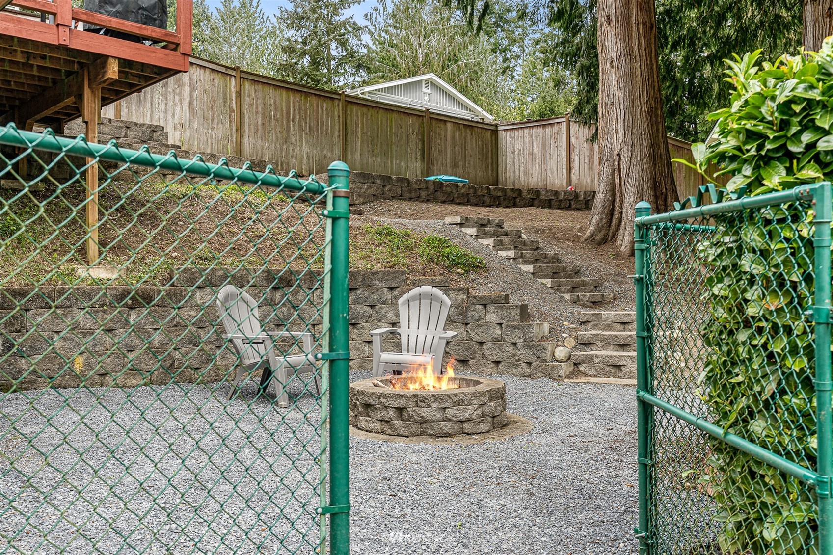 19329 Winesap Road Bothell, WA 98012 - Photo 26 of 32 a backyard of a house with table and chairs
