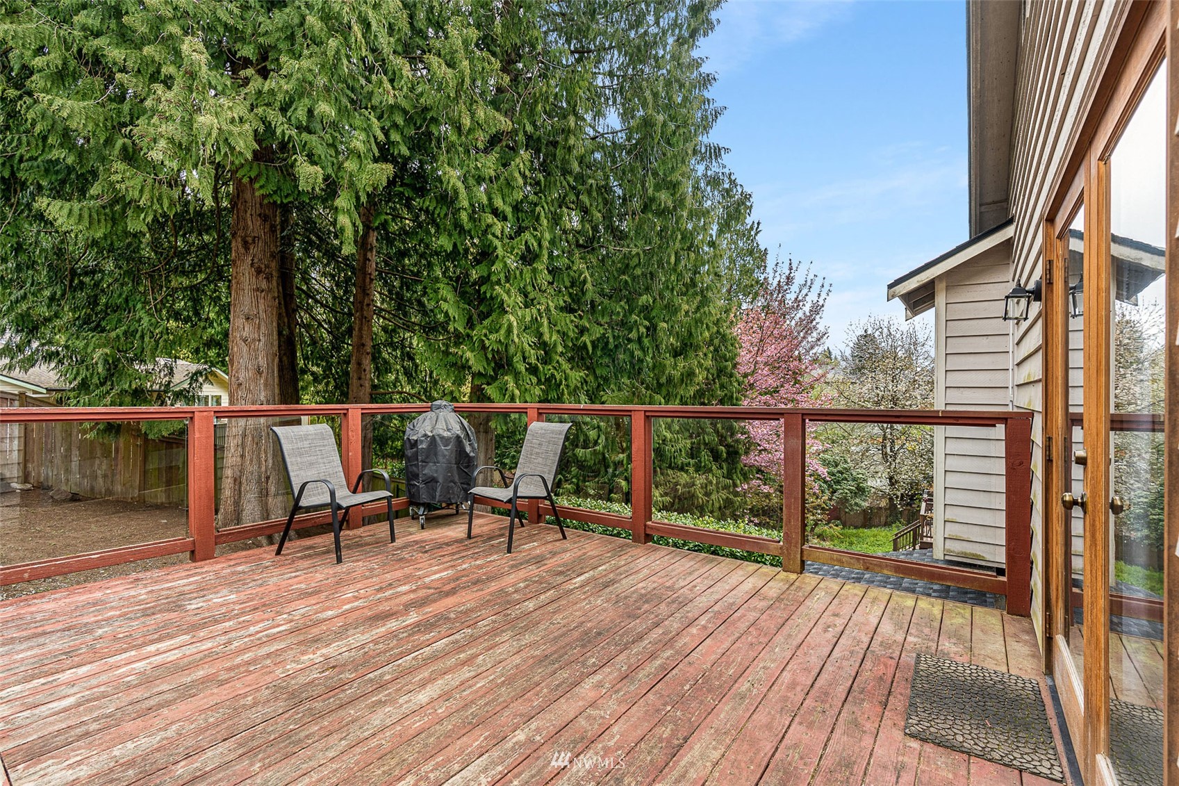 19329 Winesap Road Bothell, WA 98012 - Photo 30 of 32 a view of a deck with chairs and wooden floor