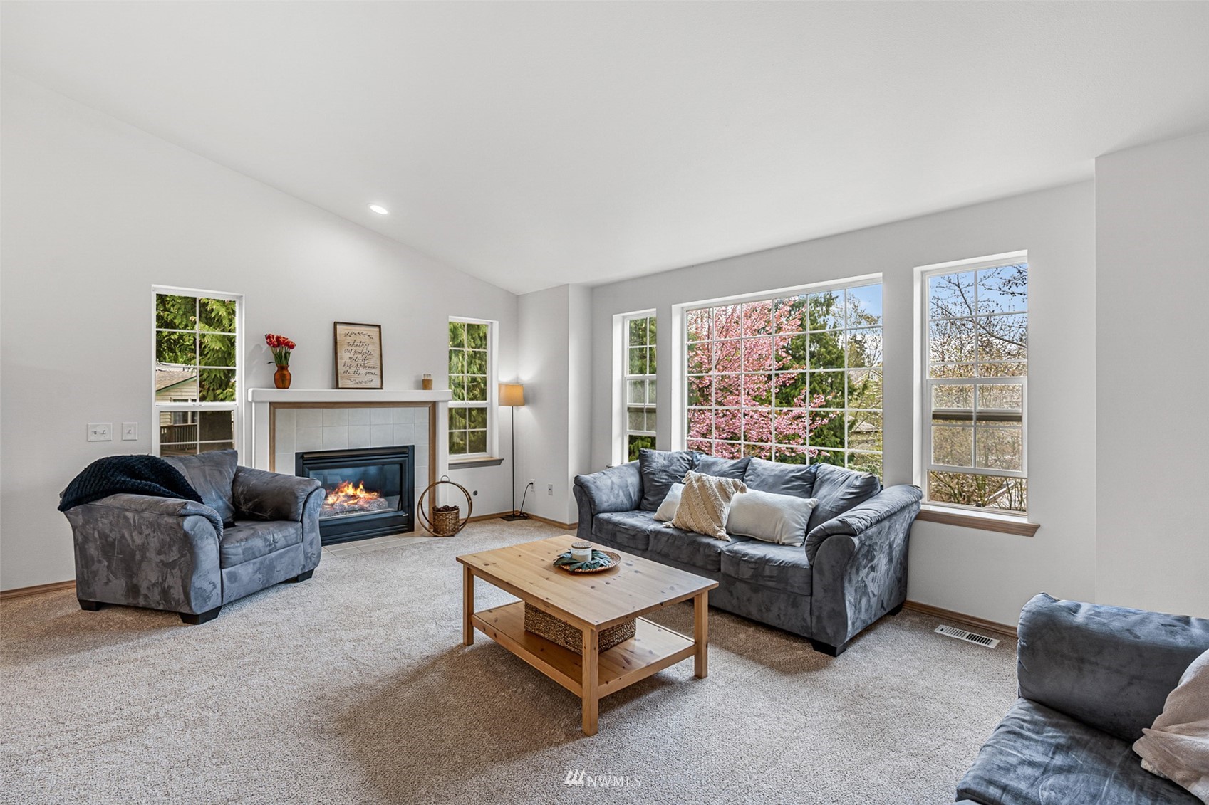 19329 Winesap Road Bothell, WA 98012 - Photo 3 of 32 a living room with furniture and a fireplace