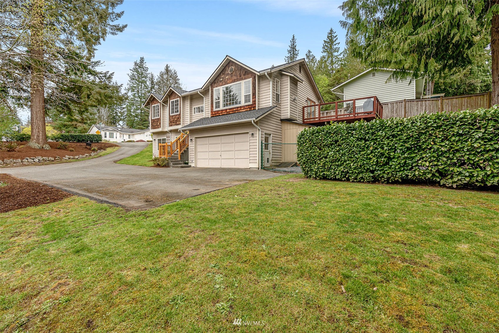 19329 Winesap Road Bothell, WA 98012 - Photo 32 of 32 a view of a big house with a big yard and large tree