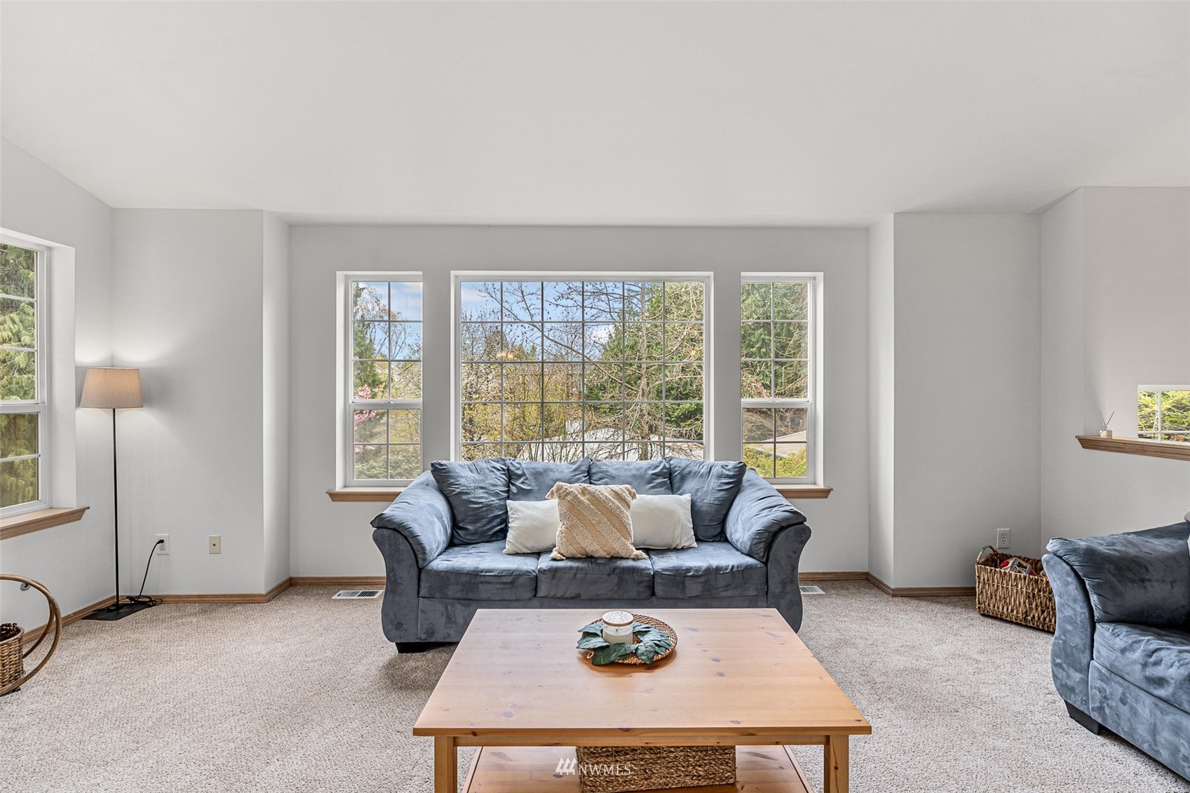 19329 Winesap Road Bothell, WA 98012 - Photo 4 of 32 a living room with furniture and a large window