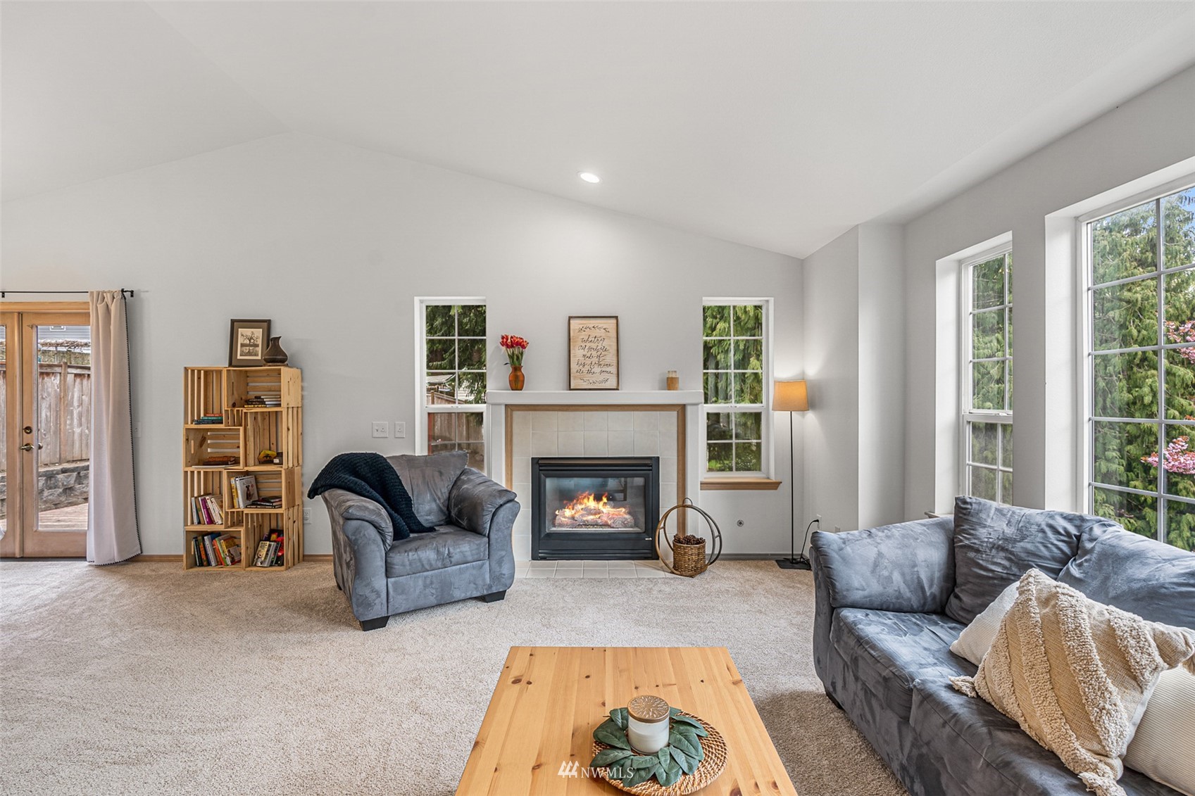 19329 Winesap Road Bothell, WA 98012 - Photo 5 of 32 a living room with furniture and a fireplace