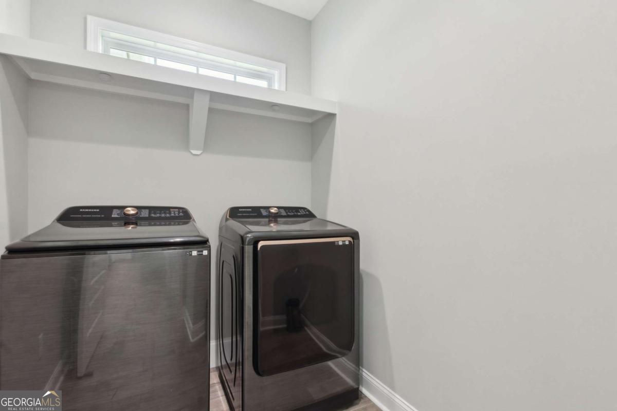 107 Amanda Trace Kingsland, GA 31548 - Photo 19 of 94 a utility room with dryer and washer
