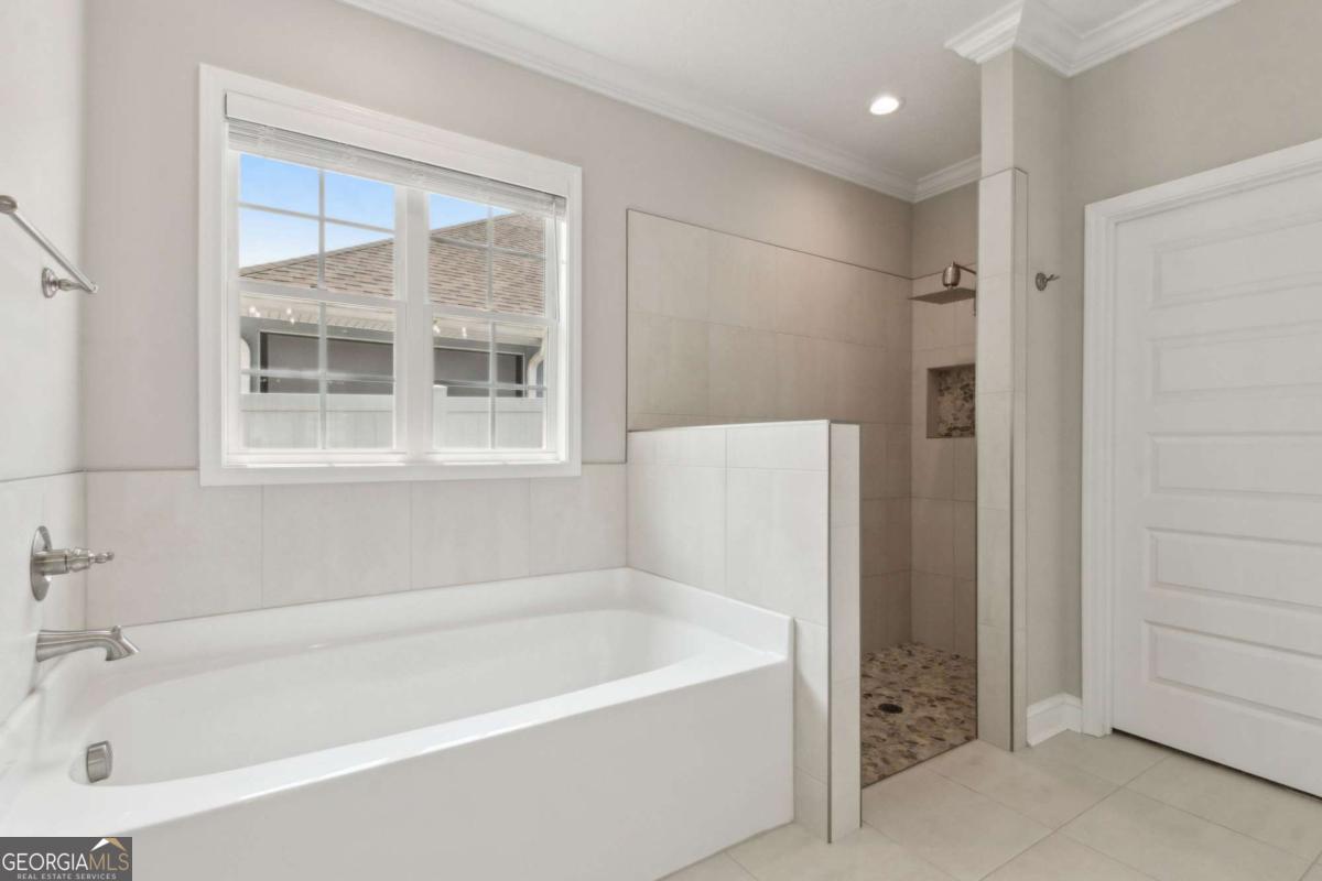 107 Amanda Trace Kingsland, GA 31548 - Photo 25 of 94 a white bath tub sitting next to a shower