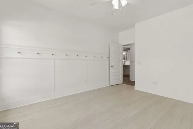 an aerial view of a house with a yard and large trees
