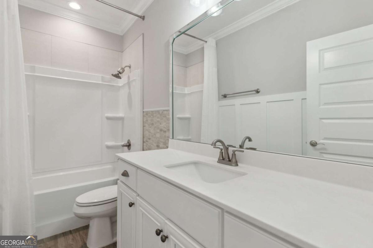 107 Amanda Trace Kingsland, GA 31548 - Photo 28 of 94 a bathroom with a sink a toilet and shower