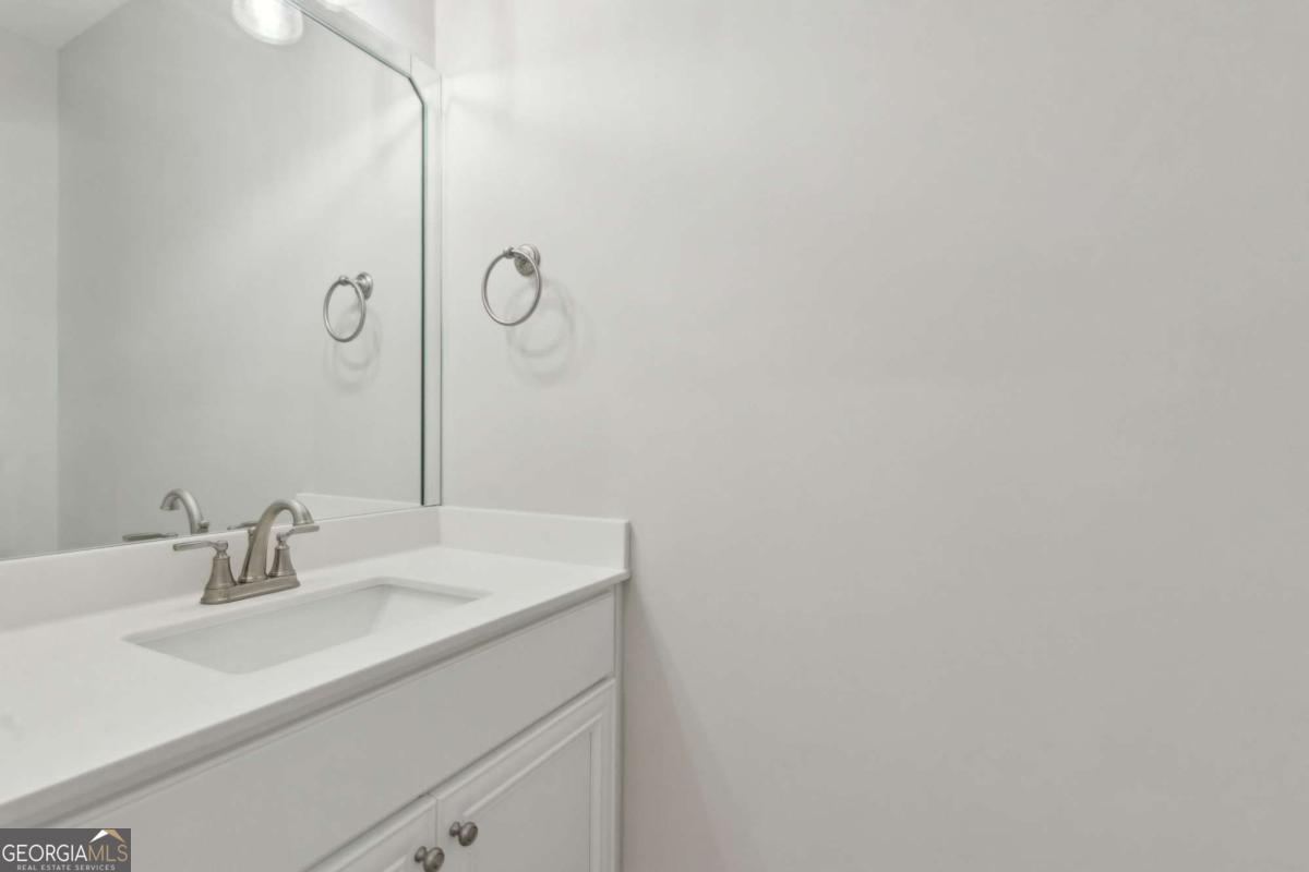 107 Amanda Trace Kingsland, GA 31548 - Photo 34 of 94 a bathroom with a sink and a mirror