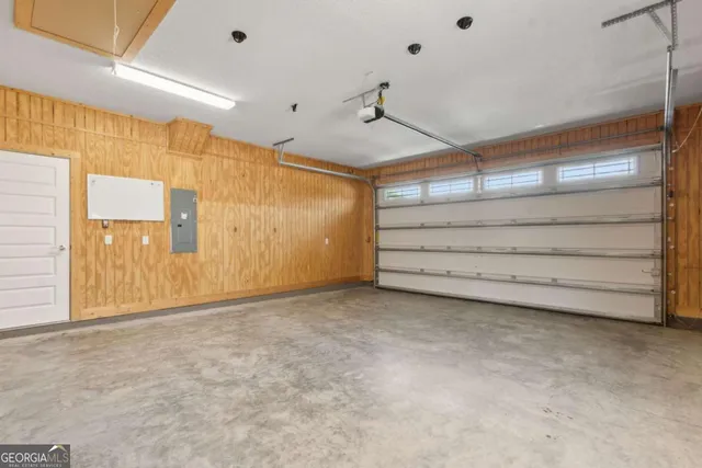 a view of a big yard with a house in the background