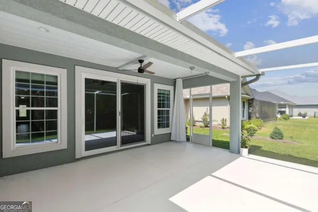 a front view of a house with a garden and a yard