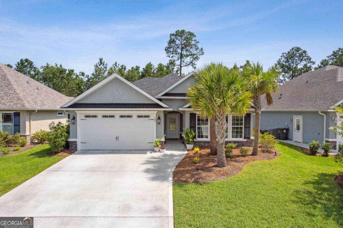 107 Amanda Trace Kingsland, GA 31548 - Photo 44 of 94 a front view of a house with garden
