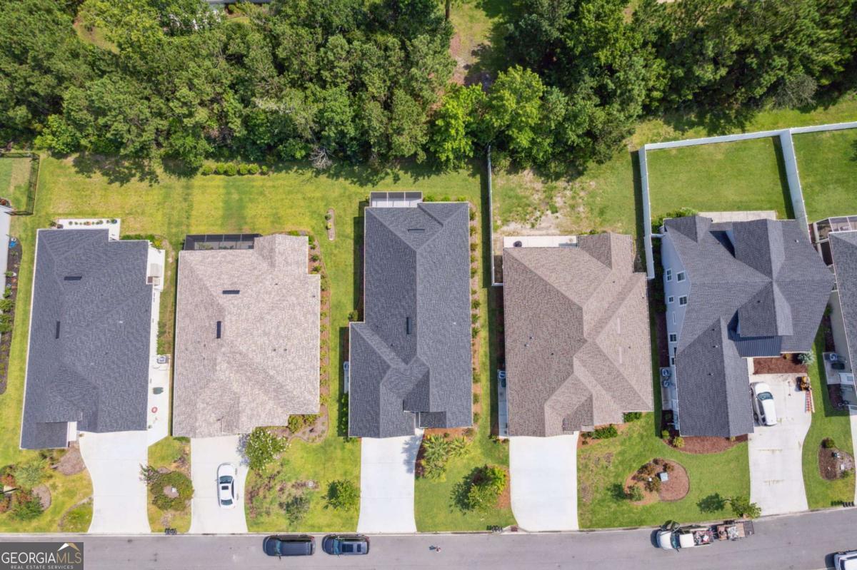 107 Amanda Trace Kingsland, GA 31548 - Photo 45 of 94 an aerial view of a house with a yard and large trees
