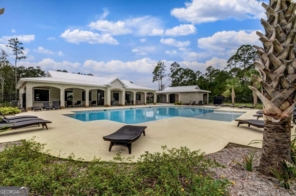 107 Amanda Trace Kingsland, GA 31548 - Photo 66 of 94 a view of a house with swimming pool and sitting area
