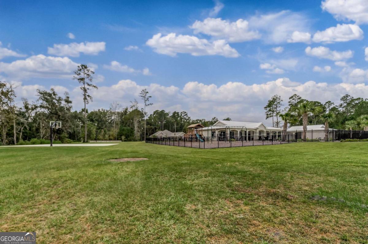107 Amanda Trace Kingsland, GA 31548 - Photo 68 of 94 a view of a big yard with a house in the background