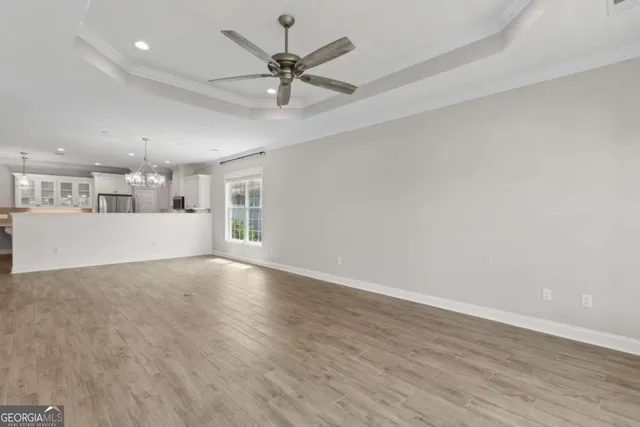 a kitchen with stainless steel appliances granite countertop a stove and a refrigerator