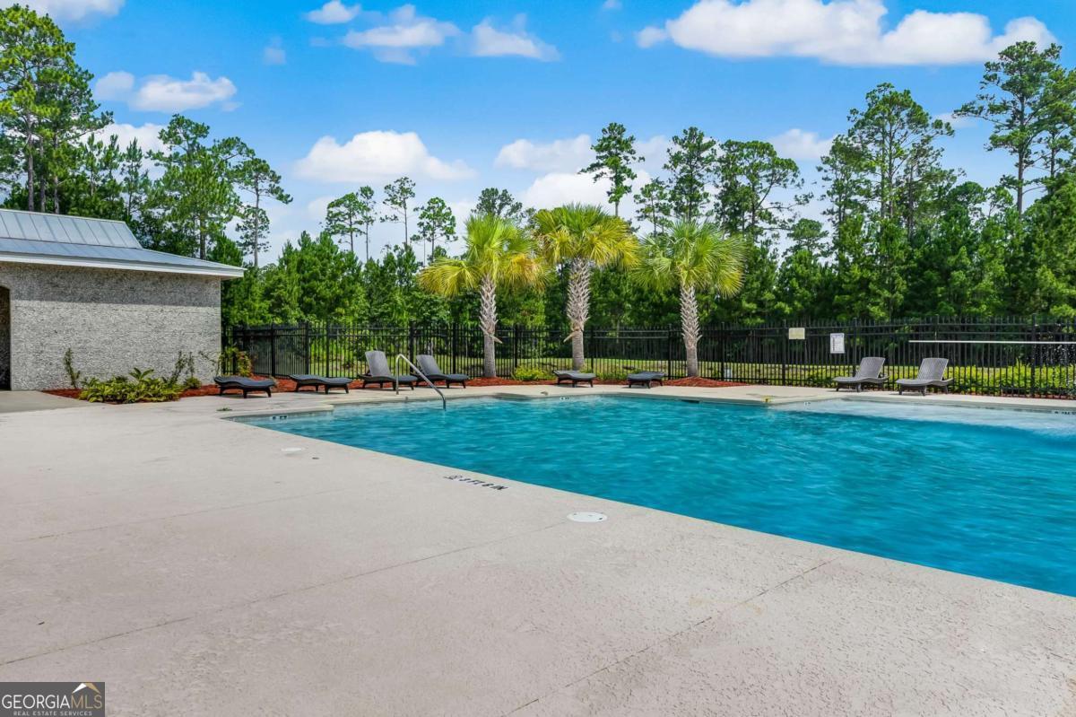 107 Amanda Trace Kingsland, GA 31548 - Photo 87 of 94 a front view of a house with a yard and trees