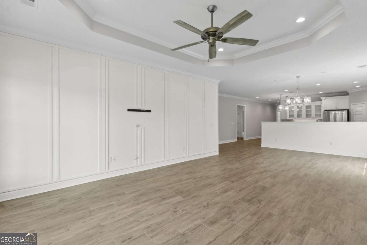 107 Amanda Trace Kingsland, GA 31548 - Photo 9 of 94 a view of a livingroom with a chandelier fan and wooden floor